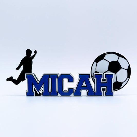 Personalized soccer nameplate "MICAH" in royal blue with player and ball