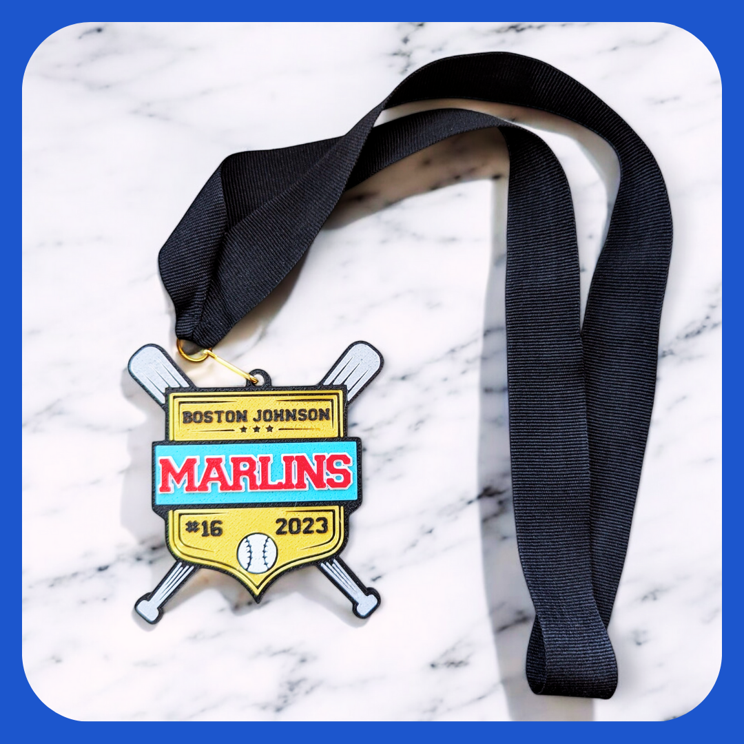 Baseball medal in gold, turquoise and red with player name and team name