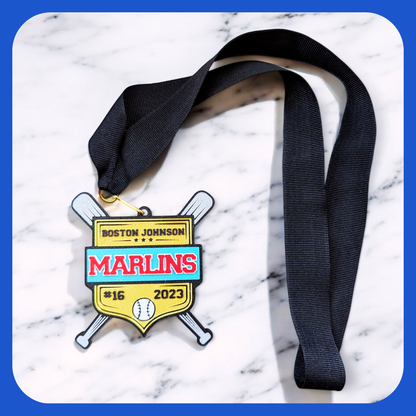 Baseball medal in gold, turquoise and red with player name and team name