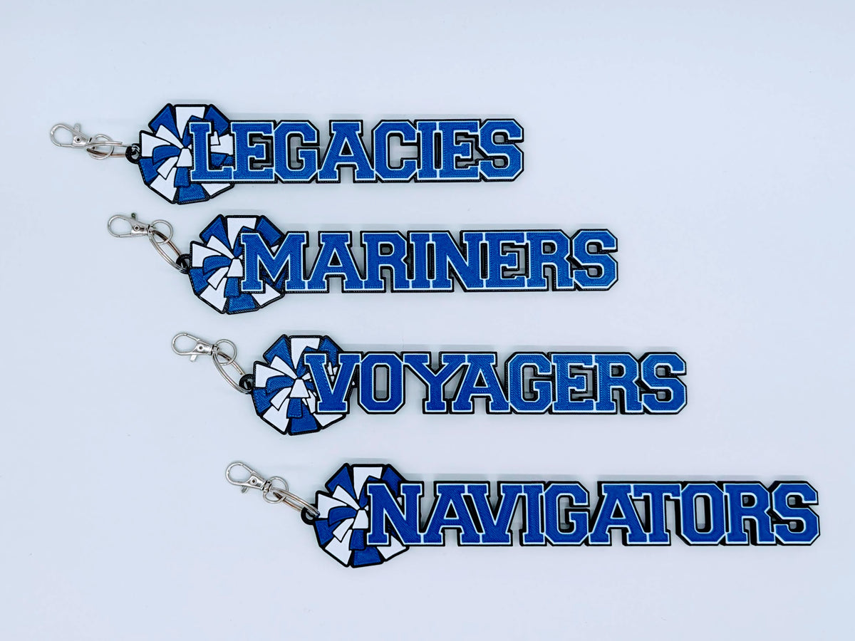 Four blue cheerleading bag tags with pom-pom for a team: LEGACIES, MARINERS, VOYAGERS and NAVIGATORS