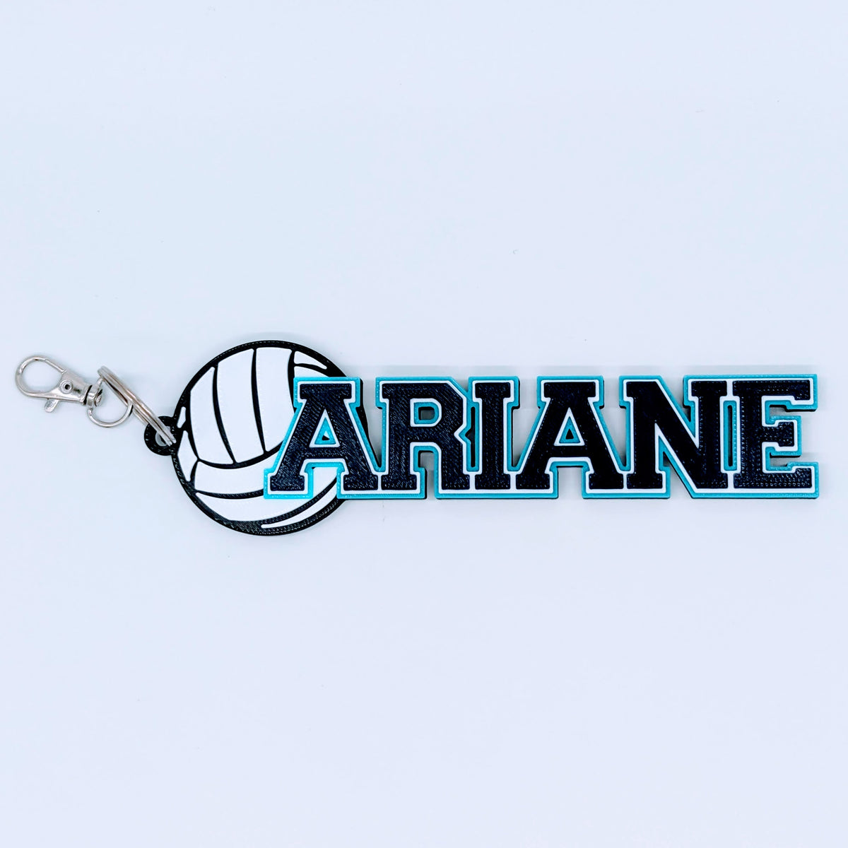 Navy blue and teal volleyball name tag "ARIANE" for a team gift