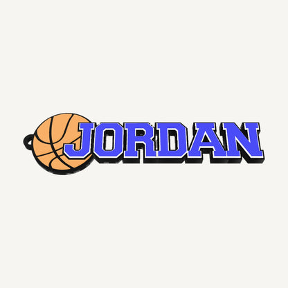 Personalized basketball bag tag "JORDAN" in blue, white and black, 3D preview