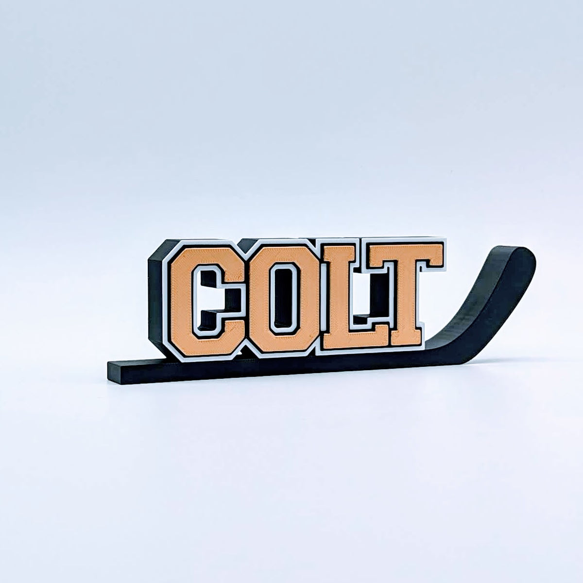 Personalized hockey stick nameplate "COLT" in copper and black