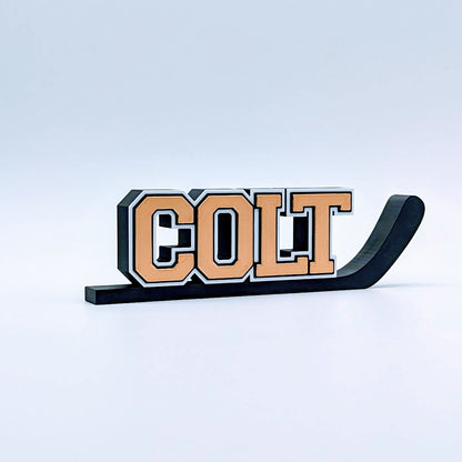 Personalized hockey stick nameplate "COLT" in copper and black