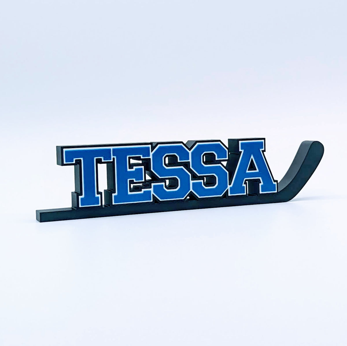 Personalized hockey stick nameplate "TESSA" in royal blue and black