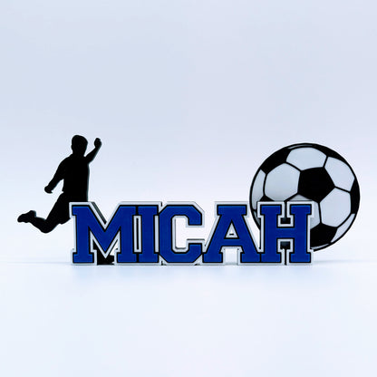 Personalized soccer nameplate "MICAH" in royal blue with player and ball