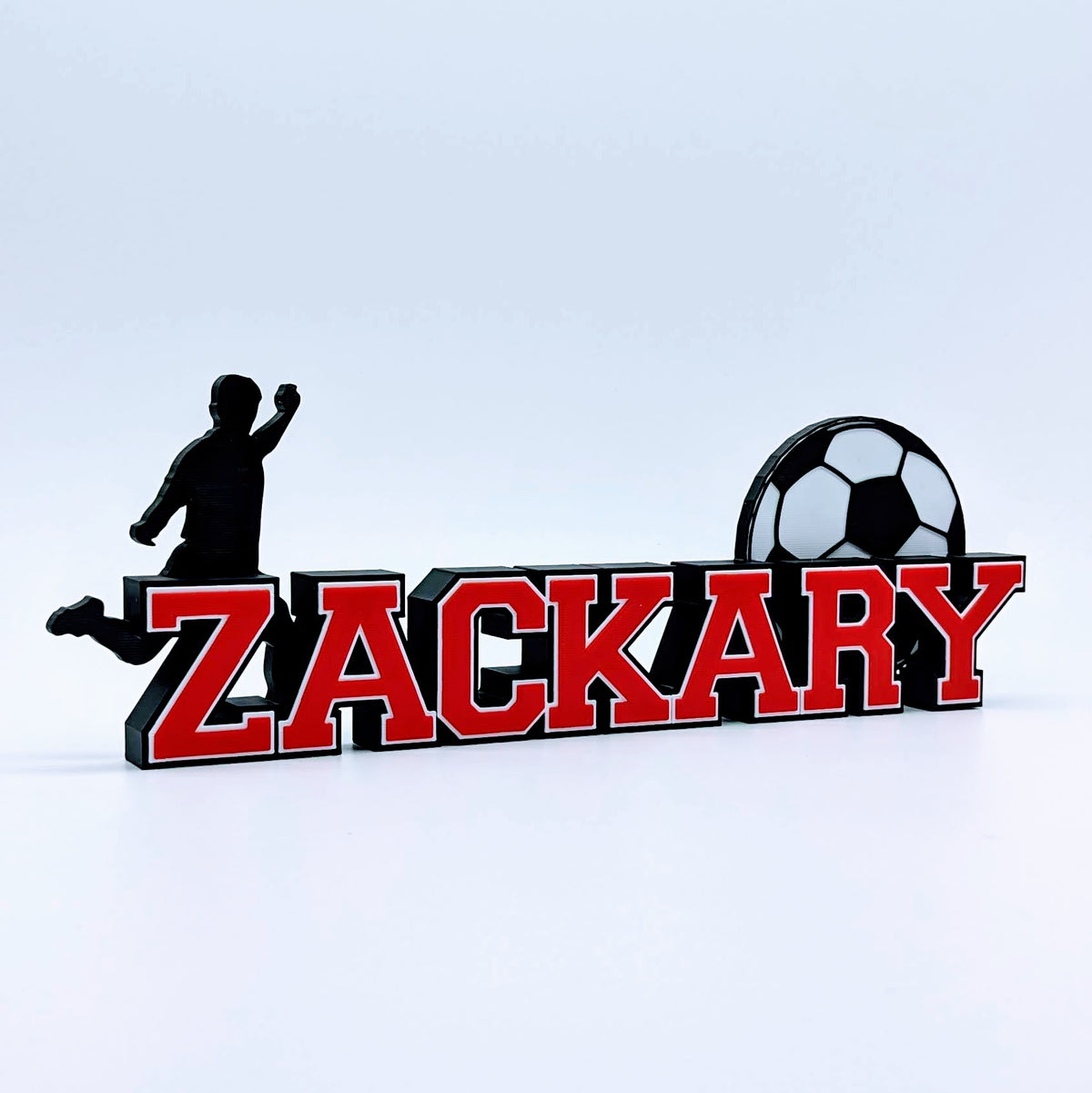 Personalized soccer nameplate "ZACKARY" in red and black, bedroom decor