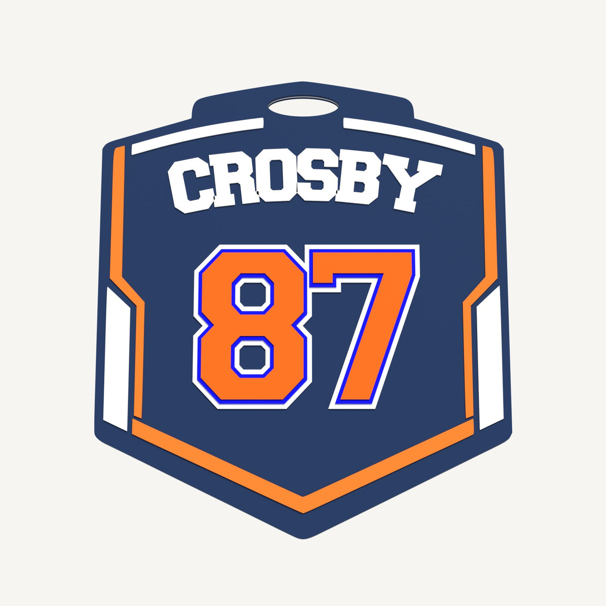 Personalized shield badge tag with player name CROSBY on top and jersey number 87 below, navy, orange and white