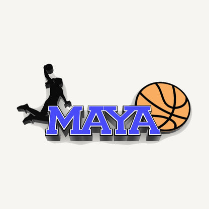 Personalized girls basketball nameplate "MAYA" in blue, white and black with female player silhouette and ball, 3D preview