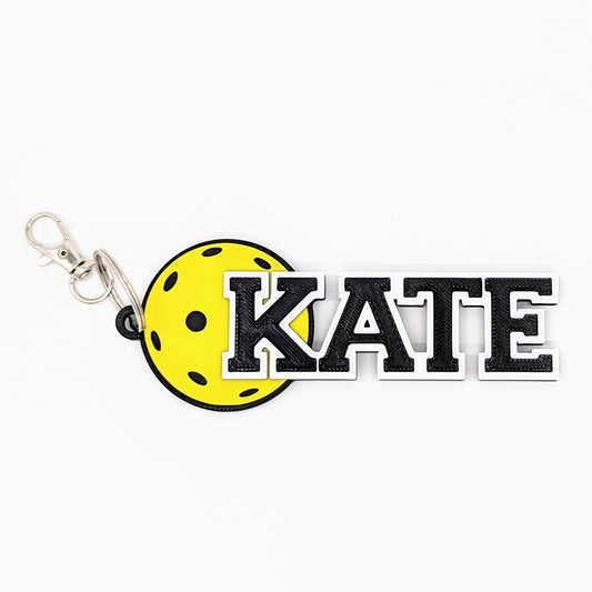 Pickleball bag tag "KATE" with yellow pickleball and black letters