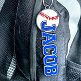 Round baseball bag tag with baseball stitch design, personalized with player name